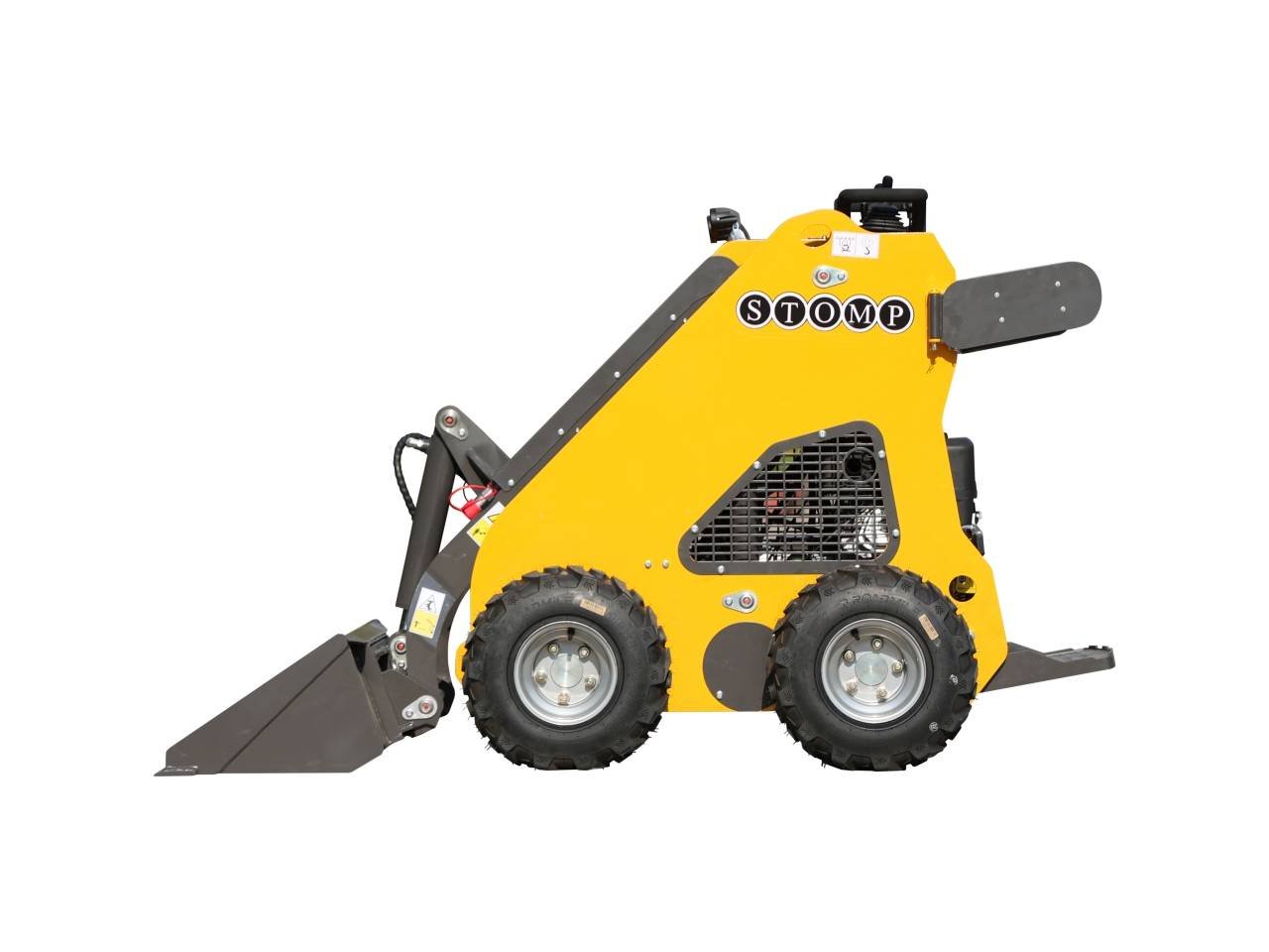 Side view of a yellow STOMP compact skid-steer loader with a front bucket attachment and rugged tires.