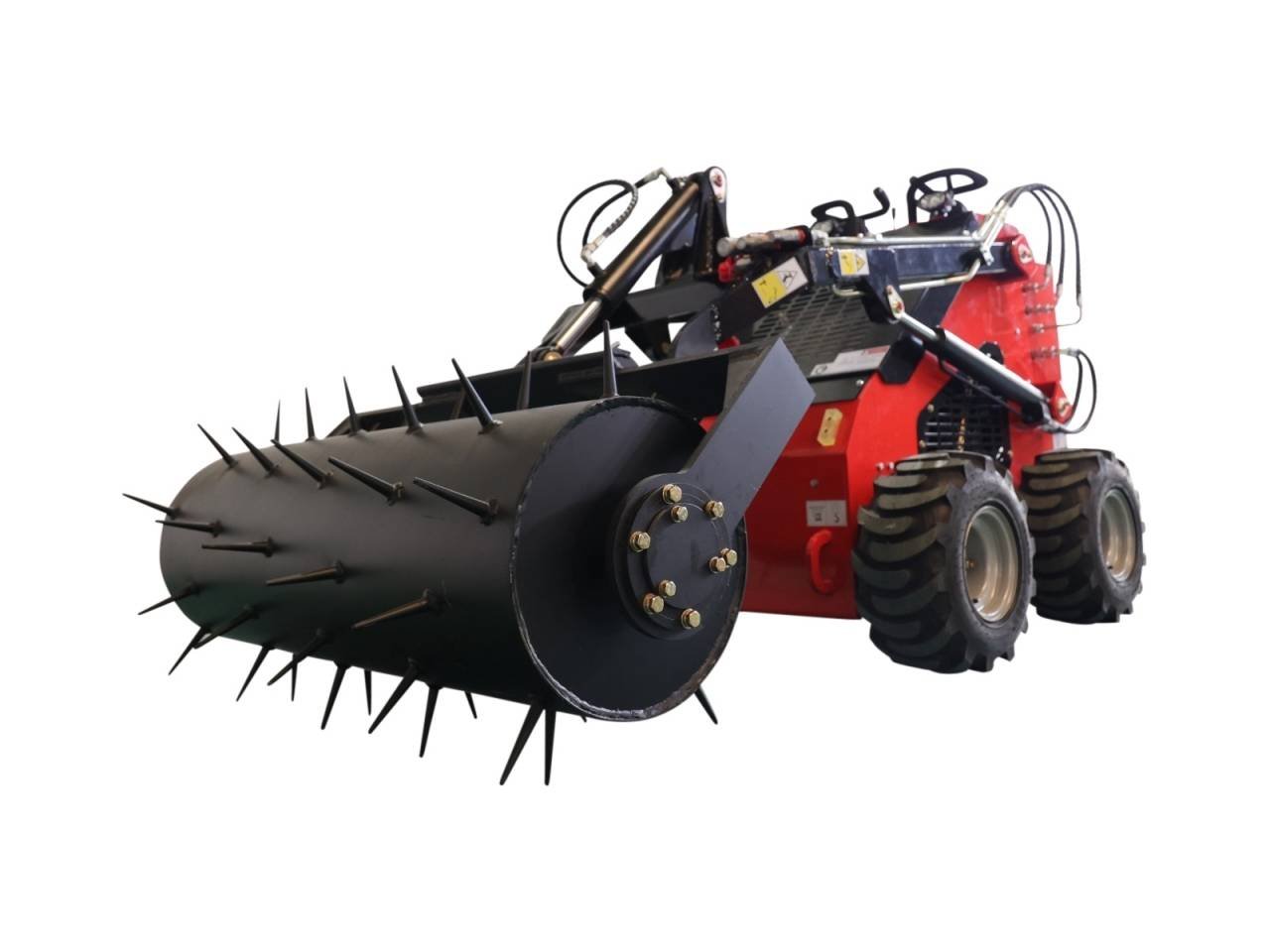 Red heavy-duty agricultural machine with a large spiked roller at the front, used for soil conditioning or crop residue processing; four large rugged tires and hydraulic arms visible.
